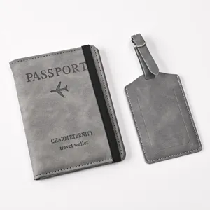 Grey PU leather passport holder and luggage tag detail view, minimalist travel set.