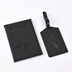 Close-up detail of the black PU leather passport holder and matching travel luggage tag set.