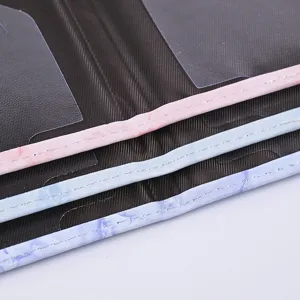 Detailed close-up of marble pattern PU leather passport cover and card holder set.