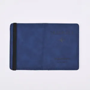 Closeup view of blue PU leather passport cover featuring elastic band and debossed logo text.