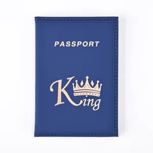 Blue PU leather passport cover detail showing gold foil crown and text stamping.