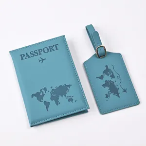 Blue PU leather passport cover and luggage tag set with world map design for travel.