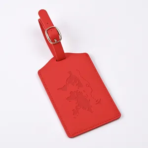 Red PU leather luggage tag with world map embossing and metal buckle, ideal travel accessory detail.