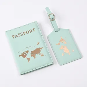 Detailed view of mint green PU leather passport cover and luggage tag set with gold foil world map.