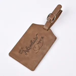 Brown PU leather luggage tag detail showing embossed adventure quote and airplane flight graphic.