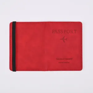 Red PU leather passport holder cover with black elastic band for travel document storage.