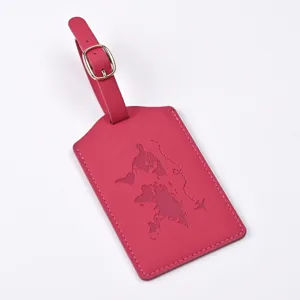 Detail view of PU leather travel luggage tag with embossed world map and airplane pattern.
