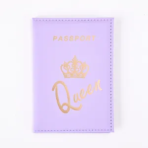 Close-up of purple PU leather passport cover with gold foil crown and queen text design.