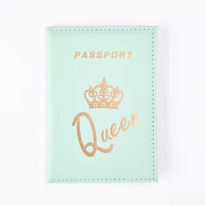 Mint green PU leather passport cover close-up, elegant gold foil crown and text detail.