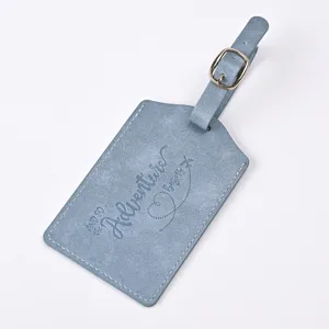 Blue PU leather luggage tag with embossed adventure quote and buckle for travel bags.