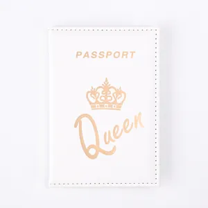 Detailed close-up view of the white PU leather passport cover with crown and gold print.