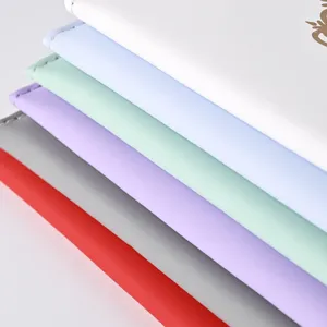 Close-up detail of multi-color PU leather passport covers, soft skin-touch texture design.
