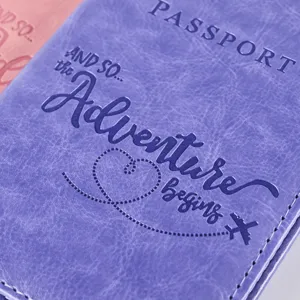 Purple PU leather passport cover with debossed quote and textured finish for travel.