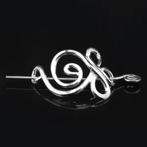 Retro metal hair stick viking celtic hairpin vintage hair accessory detailed close-up shot.