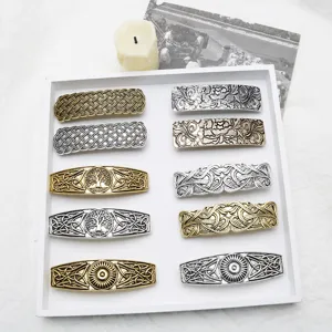 Retro vintage metal hair clips set, Viking style barrettes with intricate engraved patterns.