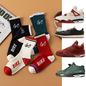 Detailed view of sports socks featuring bike and go letters with classic sneaker styles.