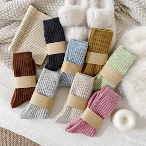 Thick warm winter wool socks for women, cozy speckled mid-tube boot socks for cold days.