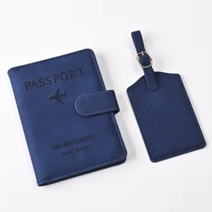 Detail view of blue PU leather passport holder and luggage tag set with magnetic snap.