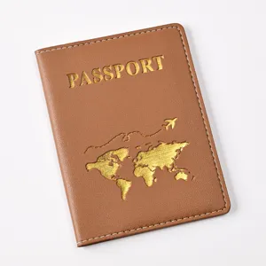Brown PU leather passport cover with gold stamped world map design, travel document holder.