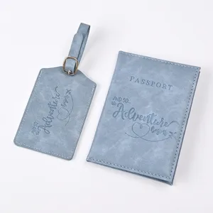 Detailed view of blue PU leather passport holder and luggage tag travel set with embossed quote.