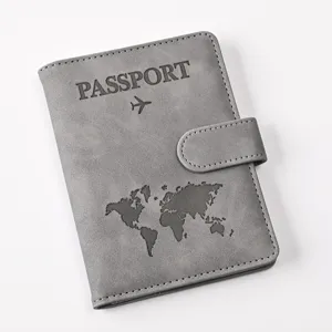 Grey PU leather passport holder with magnetic snap and world map design for travel.