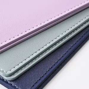 Detailed close-up of multi-color PU leather passport holder featuring fine stitching and texture.