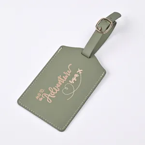 Green PU leather luggage tag with rose gold foil adventure quote and metal buckle strap.