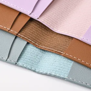 PU leather passport holder detail close-up showing fine stitching and multi-color texture options.