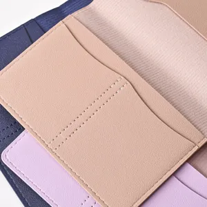 Close-up detail of multi-color PU leather passport holder, showing fine stitching and texture.