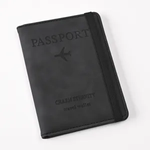 Black PU leather passport wallet with elastic band and travel text design for travel use
