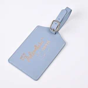 Blue PU leather luggage tag with gold foil adventure quote for travel and airport identification.