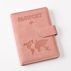 Pink PU leather passport holder with magnetic clasp and world map embossed design.