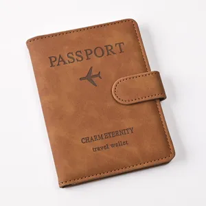Brown PU leather passport holder travel wallet with magnetic closure and card slots.