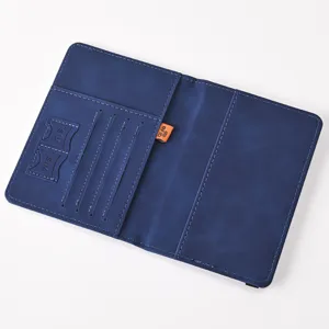 Blue PU leather passport holder with RFID blocking, multi card slots and SIM holders for travel.