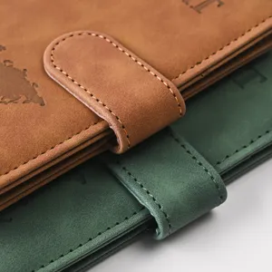 Premium PU leather passport holder detail with magnetic buckle and world map embossing.