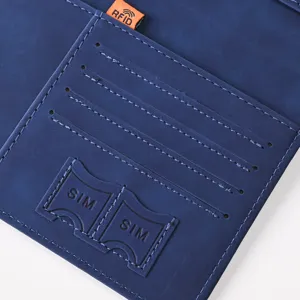Blue PU leather passport wallet interior detail showing card slots and RFID protection tag.