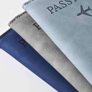 Close-up detail shot of colorful PU leather passport covers stacked neatly, texture view.