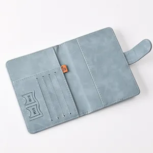 Multi-functional PU leather passport holder with magnetic closure, card slots, and RFID blocking.