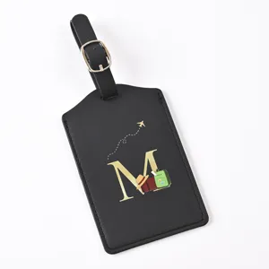 Black PU leather travel luggage tag featuring a stylish gold letter M and cute travel graphics.