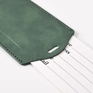 Green PU leather luggage tag with ID card slot and fine stitching detail for safe travel.