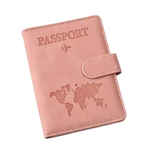 Pink PU leather passport holder with magnetic closure, world map and passport embossing.