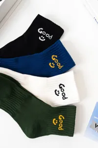 Trendy streetwear smiley embroidered cotton crew socks in four versatile colors for daily wear