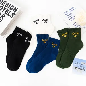 Comfortable solid color short cotton socks with cute good smiley face embroidery for casual wear.