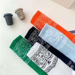 Paisley pattern detail of casual sports socks featuring vibrant multi-color woven fabric.