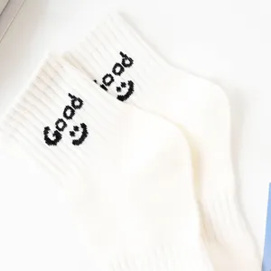 Comfortable white cotton socks featuring stylish Good and smile knit details for daily casual wear.