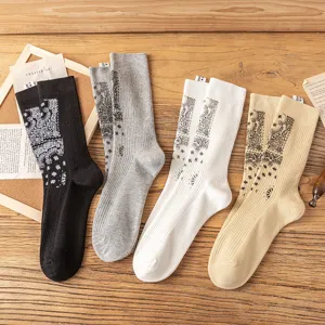 Detail view of trendy paisley print crew socks in four versatile colors, perfect for daily wear.