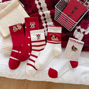 Detailed view of festive red cartoon puppy mid-tube socks, featuring cute stripes and polka dots.