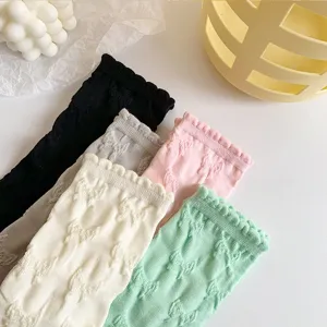 Cute bow embossed mid-tube cotton socks detailed view showing texture and colors.