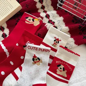 Festive red and white cotton mid-calf socks featuring cute puppy knit patterns, stripes, and dots.