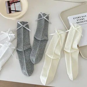 Detail shot of women socks featuring cute back bow design and comfortable ribbed fabric texture.